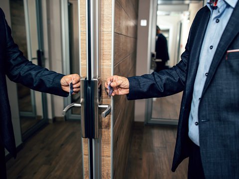 Businessman opening his hotel room